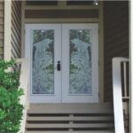 Dolphins etched on double front doors