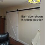 Barn door with x pattern and exposed track and hardware